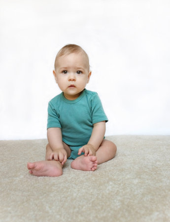 Sweet little baby boy portrait on white backgroundの写真素材