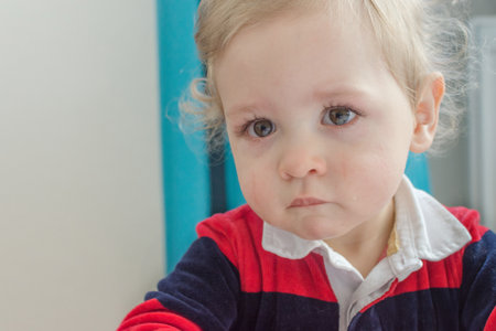Portrait of a cute little boy cryingの写真素材
