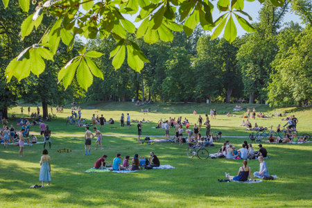 Graz, Austria-June 13, 2020: young people relaxing and playing outdoor games in the park, in summertime, Styria region, Austria. Selective focus.のeditorial素材