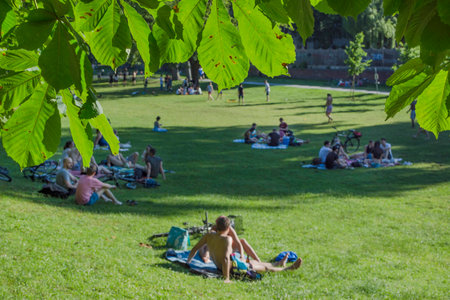 Graz, Austria-June 13, 2020: young people relaxing and playing outdoor games in the park, in summertime, Styria region, Austria. Selective focus.のeditorial素材