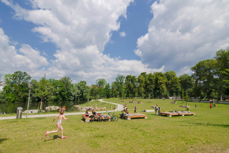 Graz, Austria-June 24, 2020: young people relaxing and playing outdoor games in the park, in summertime, Styria region, Austria. Selective focus.のeditorial素材