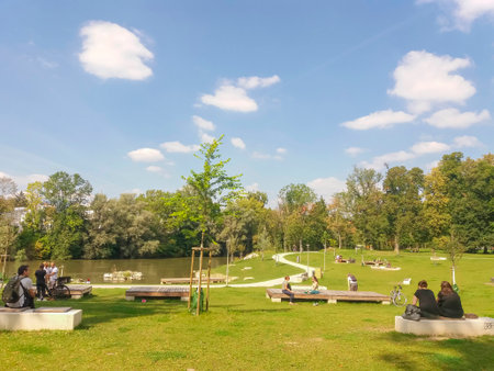 Graz, Austria-14.09.2020: people relaxing outdoor in a park near Mur river, in summer, Styria region, Austria. Selective focus.のeditorial素材