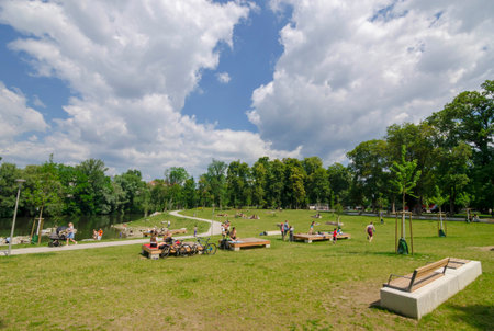 Graz, Austria-June 24, 2020: young people relaxing and playing outdoor games in the park, in summertime, Styria region, Austria. Selective focus.のeditorial素材