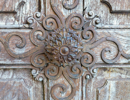 Detail of a beautiful old wooden door of Church Maria Strassengel, a 14th century Gothic pilgrimage church in the town of Judendorf Strassengel near Graz, Styria region, Austriaの写真素材