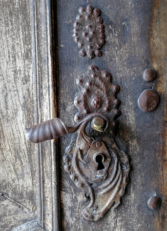 Detail of a beautiful old wooden door of Church Maria Strassengel, a 14th century Gothic pilgrimage church in the town of Judendorf Strassengel near Graz, Styria region, Austriaの写真素材