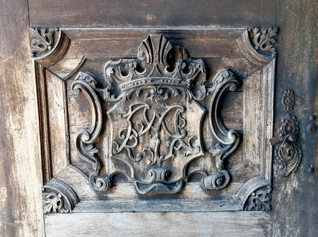 Detail of a beautiful old wooden door of Church Maria Strassengel, a 14th century Gothic pilgrimage church in the town of Judendorf Strassengel near Graz, Styria region, Austriaの写真素材