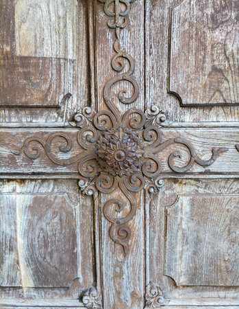 Detail of a beautiful old wooden door of Church Maria Strassengel, a 14th century Gothic pilgrimage church in the town of Judendorf Strassengel near Graz, Styria region, Austriaの写真素材
