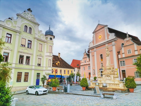 The main square with old buildings and Parish Church in the charming little town of Frohnleiten in the district of Graz-Umgebung, Styria region, Austriaの写真素材