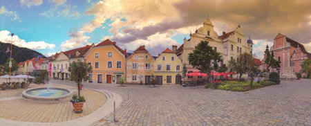 Frohnleiten, Austria- June 25, 2021: The main square with old buildings and Parish Church in the charming little town of Frohnleiten in the district of Graz-Umgebung, Styria region, Austriaのeditorial素材