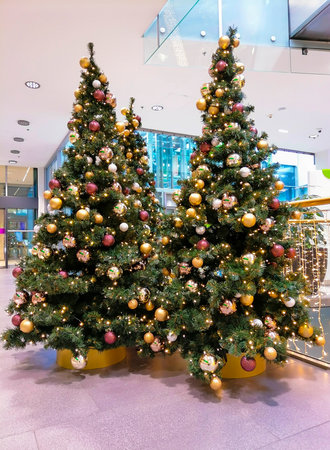 Beautiful and colorful Christmas tree, holidays decorationsの写真素材