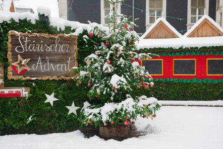 Styrian advent (Steirischer Advent), a beautiful Christmas market in the city center of Graz, Styria region, Austria, in a beautiful winter snowy dayの写真素材