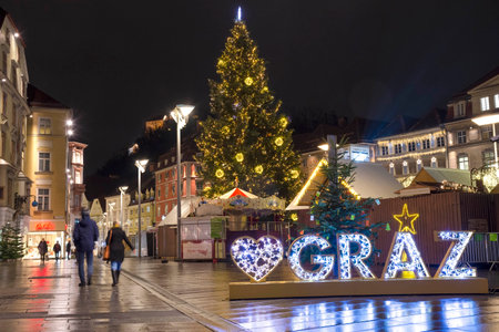 Graz, Austria-December 02, 2021: Beautiful Christmas decorations at famous main square Hauptplatz, at night, in the city center of Graz, Steiermark, Austria.のeditorial素材