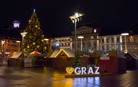 Graz, Austria-December 02, 2021: Beautiful Christmas decorations at famous main square Hauptplatz, at night, in the city center of Graz, Steiermark, Austria.のeditorial素材