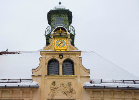 Detail of an old historical building (Gottfried Maurer House) in Glockenspielplatz Square in Graz, Steiermark, Austria, with snow, in winterの写真素材