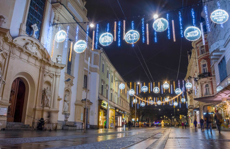 Graz, Austria-December 02, 2021: Beautiful Christmas decorations and lights on famous Herrengasse street, at night, in the city center of Graz, Steiermark, Austria. Selective focusのeditorial素材