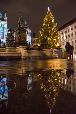Graz, Austria-December 02, 2021: Beautiful Christmas decorations at famous main square Hauptplatz, at night, in the city center of Graz, Steiermark, Austria.のeditorial素材
