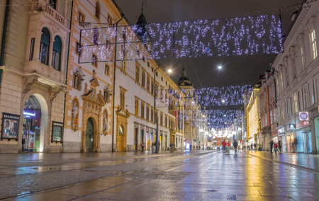 Graz, Austria-December 02, 2021: Beautiful Christmas decorations and lights on famous Herrengasse street, at night, in the city center of Graz, Steiermark, Austria. Selective focusのeditorial素材
