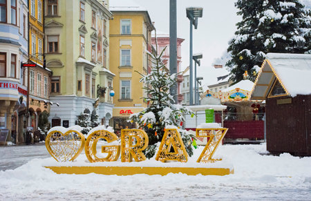 Graz, Austria-December 09, 2021: The beautiful Main square Hauptplatz in the city center of Graz, Steiermark, Austria, with snow, in winter dayのeditorial素材