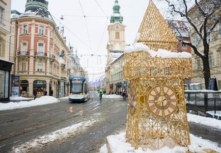 Graz, Austria-December 09, 2021: Herrengasse street after a heavy snow with heavy traffic and beautiful Christmas decorations, in the city center of Graz, Steiermark, Austria.のeditorial素材