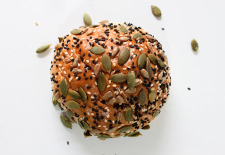 Multi grain bun on wooden trayの写真素材