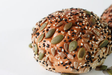 Multi grain bun on wooden trayの写真素材