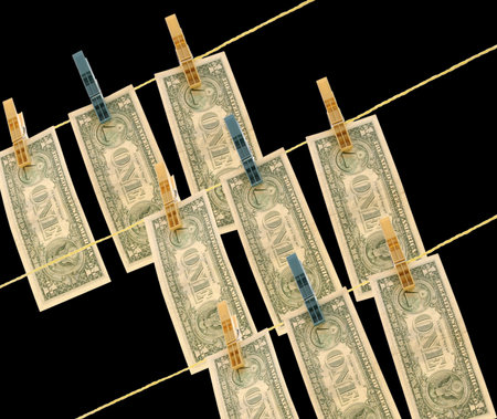 Dollars on the wire isolated on blackの写真素材