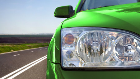 Green car on the road