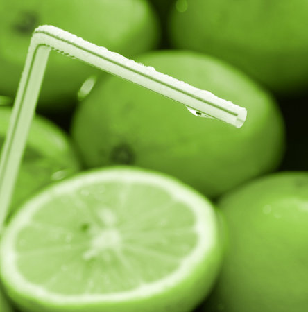 Orange and lemon juice with straw. Blur imageの写真素材