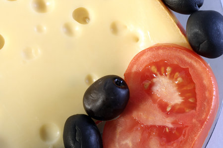 Roquefort cheese with tomato and oliveの写真素材