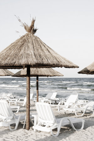 Beach with sunbeds and umbrellas.の写真素材