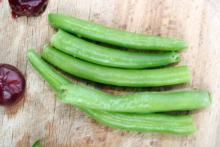 Plate with fresh cherry and beans.