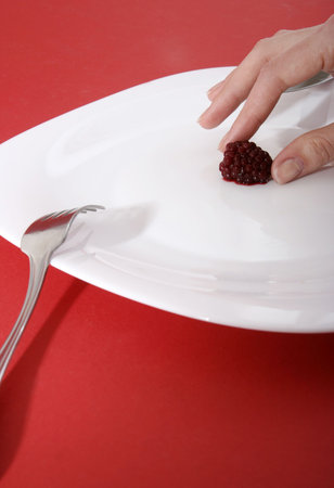Blackberry on a white plate.