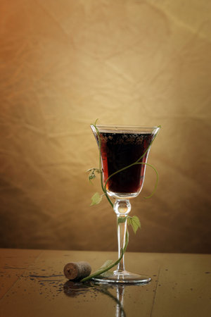 red wine glass against classic backgroundの写真素材