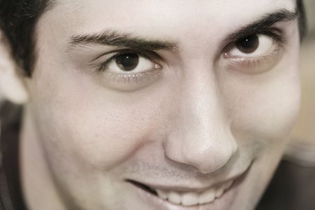 Close-up of a happy young guy.の写真素材