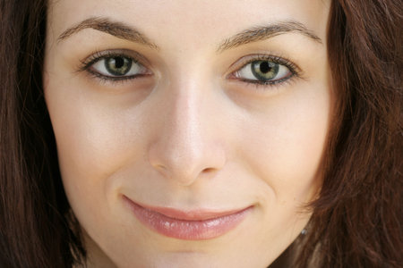 Portrait of a happy beautiful woman with green eyes.の写真素材