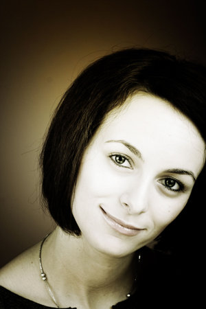 Portrait of a happy beautiful woman with green eyes.の写真素材
