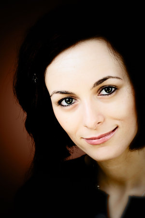 Portrait of a happy beautiful woman with green eyes.の写真素材