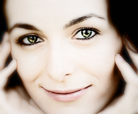 Beautiful happy woman with green eyes.の写真素材