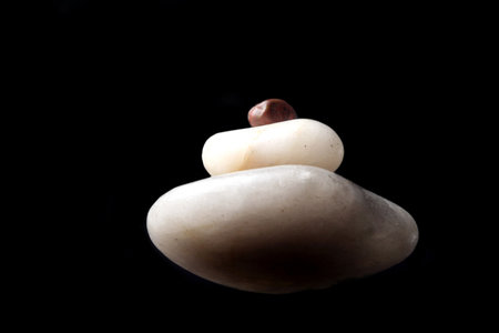 Concept made by many rocks isolated on black.の写真素材