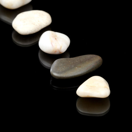 Concept made by many rocks isolated on black.の写真素材