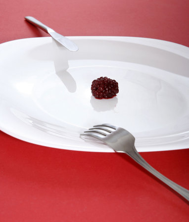 Blackberry on a white plate.の写真素材