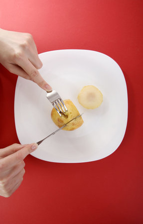 Eating a tasty yellow pear.の写真素材