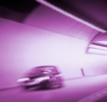 Car lights trails in a tunnelの写真素材