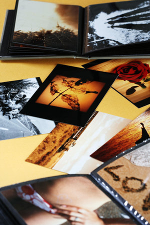 Close-up of opened photo album.の写真素材