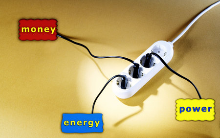 Closeup picture of a white outlet isolated on yellow.の写真素材