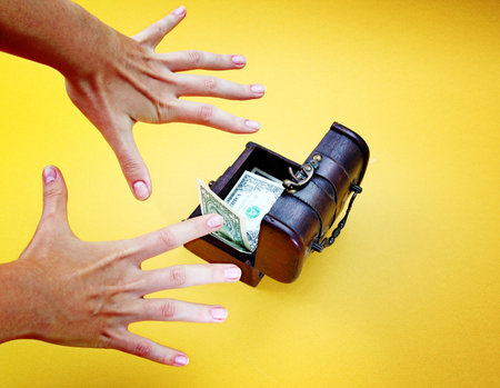 Wood cashbox isolated on yellowの写真素材