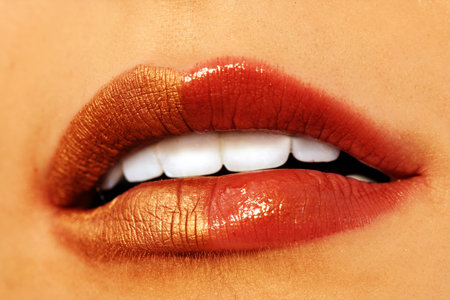 Macro image of bright lips. Red and gold lipstikの写真素材
