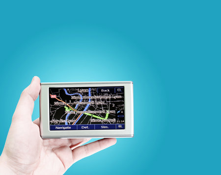 Gps in a man hand. Find your way !の写真素材