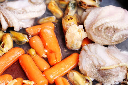 Vegetables and seafood fryed in pan.の写真素材