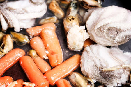 Vegetables and seafood fryed in pan.の写真素材